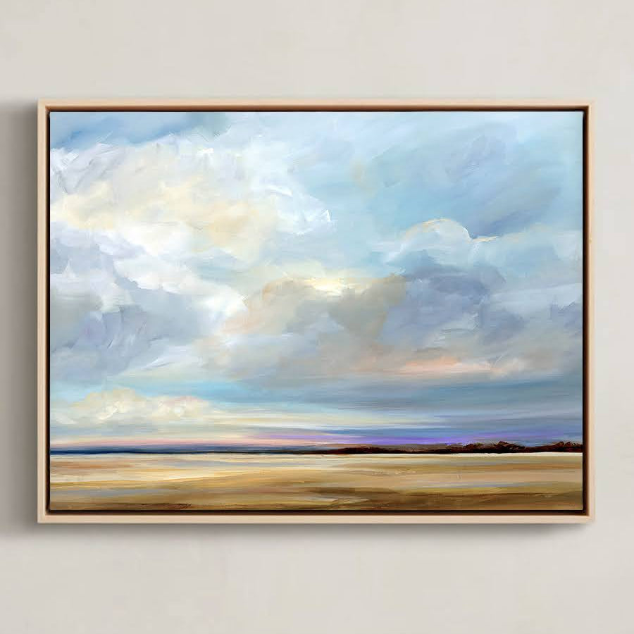 Framed artwork of a landscape painting with clouds and a field